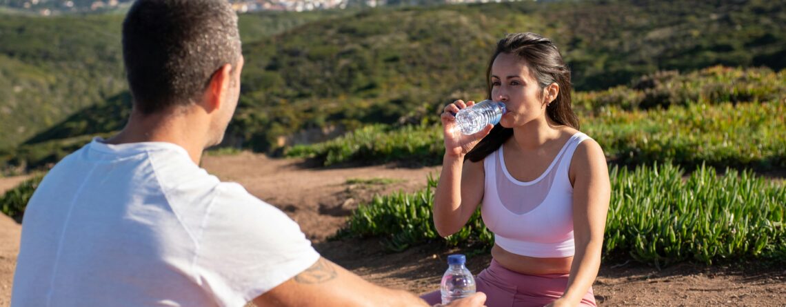 woman drinking alaline water after exercise